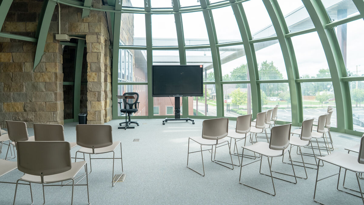 Inside The Globe Room — a glass dome wrapping a circular meeting space in full natural light
